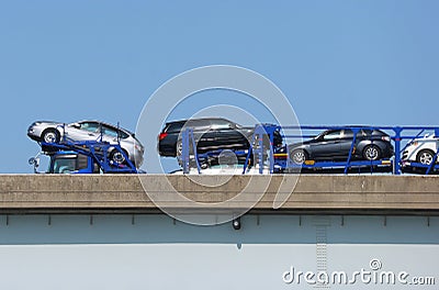 2019 March 29. Tokyo Japan. A big truck carry new cars for delivery at motor way road. Editorial Stock Photo