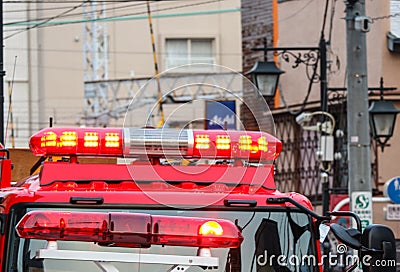 2017 MARCH 19. TOKYO JAPAN. Red siren light part of firetruck with parking and stand by for help at accident place Editorial Stock Photo