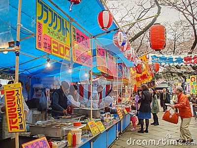 2010 March 26. Tokyo Japan. A traditional Japanese outdoor fast food or YATAI shop on Sakura cherry blossom hanami festival on spr Editorial Stock Photo