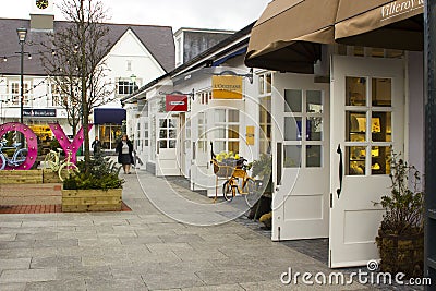 A woman laden with carrier bags while enjoying some retail therapy at the up market Kildare Village shopping outlet in County Kil Editorial Stock Photo