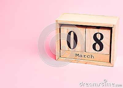 8 march wooden calendar on the pink background. Womens day concept. Copy space, close up, minimalism Stock Photo