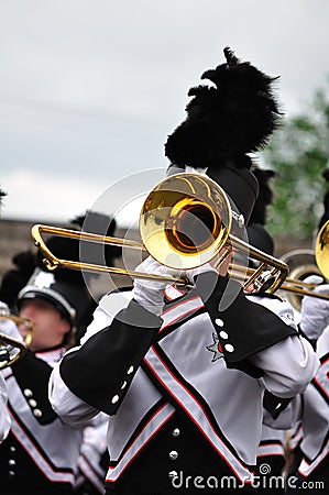 Marching Band Performer Playing Trombone in Parade Stock Photo