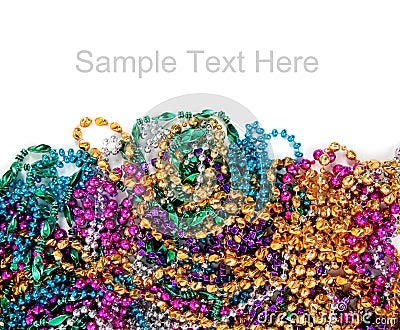 Mardi gras beads on white with copy space Stock Photo