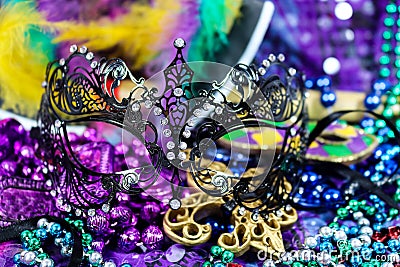 Mardi Gras Carnaval background - bright beautiful colors with mask and beads Stock Photo