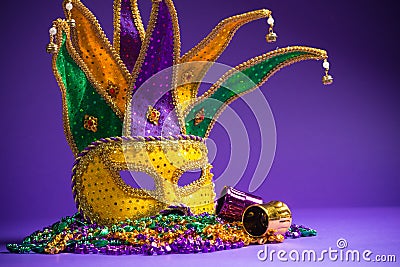 Mardi Gras or Carnivale mask on a purple background Stock Photo