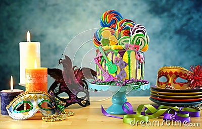 Mardi Gras theme on-trend candyland fantasy drip cake. Stock Photo