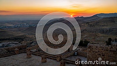 Mardin landscape at sunset with dome of Kasimiye Madrasah in old town Mardin, Turkey Stock Photo