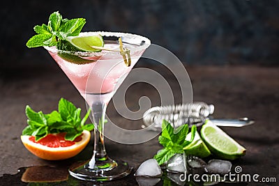 Margarita cocktail with salted rim, fresh lime and grapefruit juice, cold summer citrus refreshing drink or beverage with ice Stock Photo