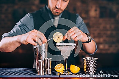 Margarita drink, alcoholic beverage, cocktail with lime garnish and lemons Stock Photo