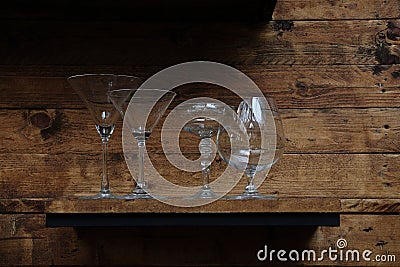 margarita,martini and brandy glasses on classic wooden shelf Stock Photo