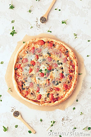 Margherita home made pizza with mushrooms. Top view on white table Stock Photo