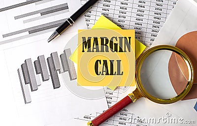 MARGIN CALL text on a sticky on red notebook on chart background Stock Photo