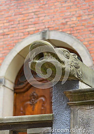 Mariacka street, grotesque gargoyle on front of tenement house, Gdansk, Poland Stock Photo