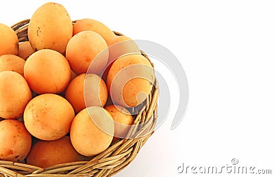 Marian plum on basket Stock Photo