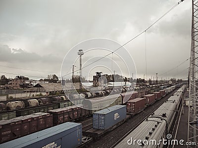 Long freight and passenger trains at the railway station of Mariinsk, Russia, on the Trans-Siberian railway Editorial Stock Photo