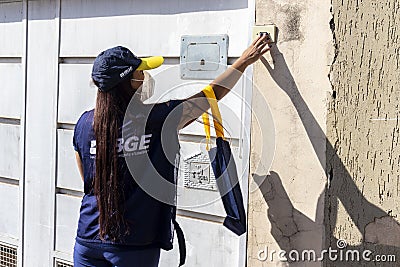 Census taker at the door of a house to collect data Editorial Stock Photo