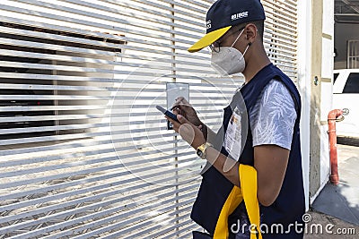 Census taker at the door of a house to collect data Editorial Stock Photo