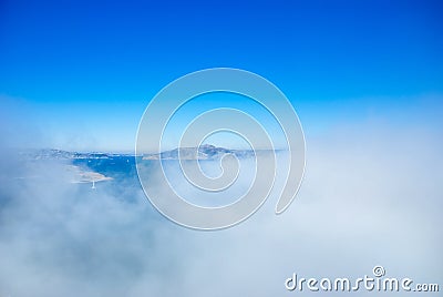 Marin headland and San Francisco bay on foggy day with clear blu Stock Photo