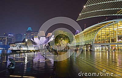 Marina Bay Sands Promenade Event Plaza with The Shoppes and Art Science Museum & Louis Vuitton Island Maison on a rainy day Editorial Stock Photo