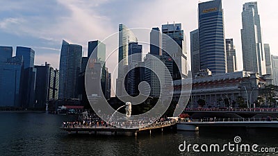 Marina Bay, Singapore May, 2018: View of business district and The Merlion Park. Moving clouds with Singapore city Editorial Stock Photo