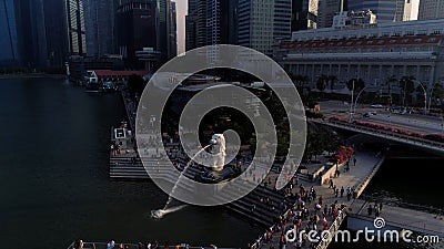 Marina Bay, Singapore May, 2018: View of business district and The Merlion Park. Moving clouds with Singapore city Editorial Stock Photo