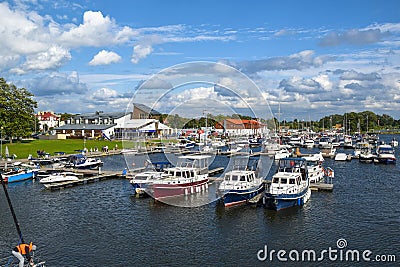 Marina in Gizycko on Lake Niegocin with moored boats, Masuria, Poland Editorial Stock Photo