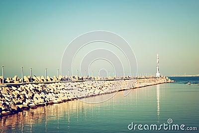 Marina with the lighthouse and the sea. vintage filtered image Editorial Stock Photo