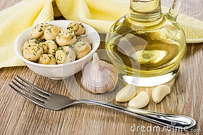 Marinated champignons with dill in bowl, garlic, vegetable oil Stock Photo