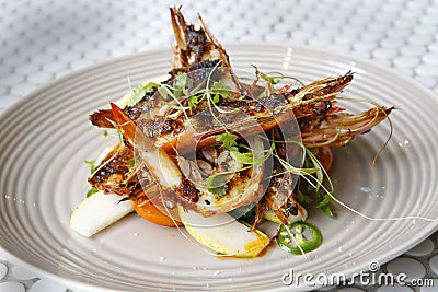 Marinated giant prawns with wild rocket pear & parmesan salad ( Stock Photo