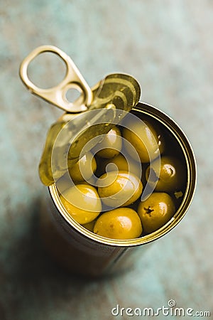 Marinated green olives in can Stock Photo