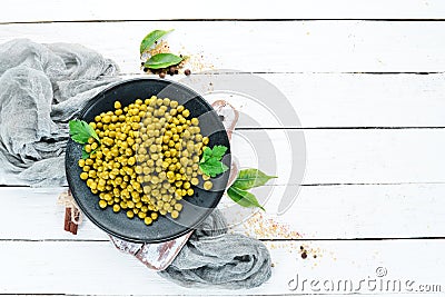 Marinated green peas on a plate. Top view. Stock Photo