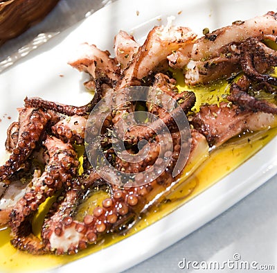 Marinated grilled octopus taverna greek islands Stock Photo