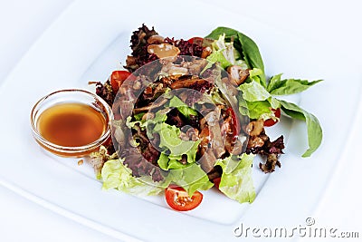 Marinated mushrooms, salad, lettuce, on the plate Stock Photo