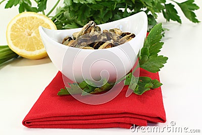 Marinated mussels with flat leaf parsley Stock Photo