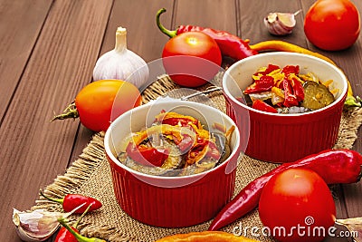 Marinated salad with pickled vegetables: eggplant, carrot, pepper, tomato, garlic Stock Photo