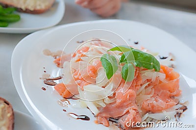 Marinated salmon carpaccio salad with basilic Stock Photo