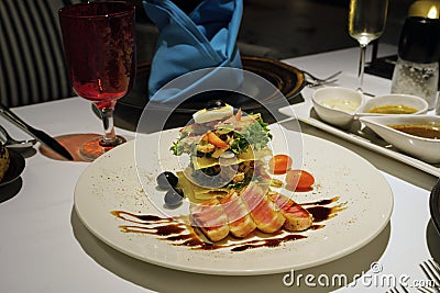 Marinated yellow tuna loin with tower salad for dinner at restaurant Stock Photo