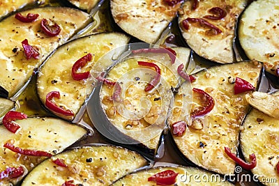 Marinating Eggplant Ready for Grilling. Stock Photo