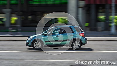 Marine Blue color Suzuki SX4 car moving fast in the street Editorial Stock Photo