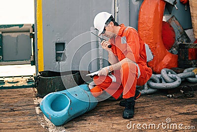 Chief officer on deck of ship or vessel with checklist Stock Photo