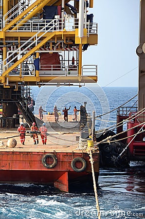 Marine crews work on mooring ropes Editorial Stock Photo