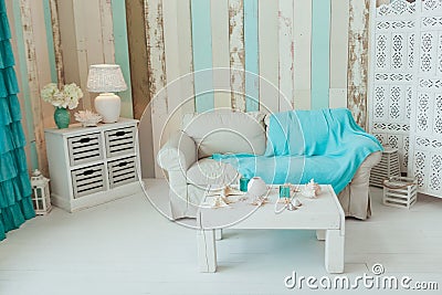 Marine Interior. White sofa and table, seashells, turquoise decor Stock Photo