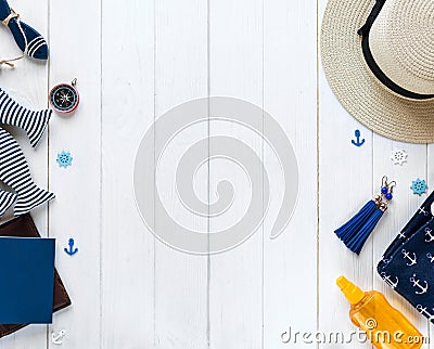 Marine items on wooden background. Sea objects: straw hat, swimsuit, fish, shells . flat lay, copy space. vacation and travel Stock Photo