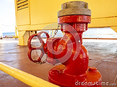 Marine red valve hydrant, part of fire extinguishing system. Industrial fire safety concept Stock Photo