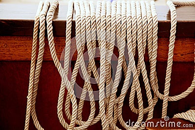 Marine ropes in a row on vintage wooden boat Stock Photo