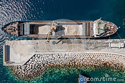 Marine works construction equipment and machinery, aerial drone top down view, Sand loading machine ship Stock Photo