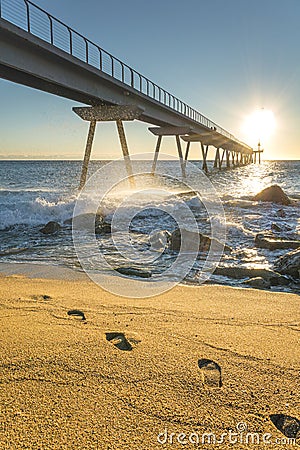 Maritime bridge at sunrise with rocks Stock Photo