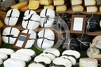 Market counter with caprine cheese Stock Photo