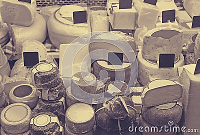 Market counter with different cheese kinds Stock Photo