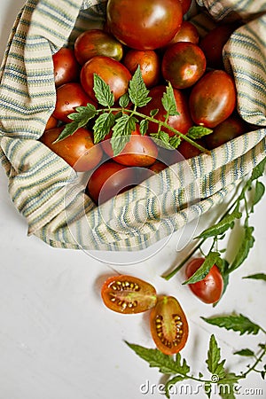 Market delivary of brown tomatoes in eco textile bag, Zero waste Stock Photo